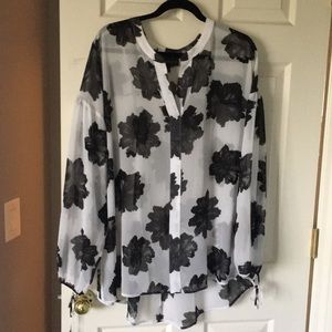Gorgeous sheer blouse with black flowers.